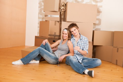 Local movers unpacking boxes in a Lambeth flat
