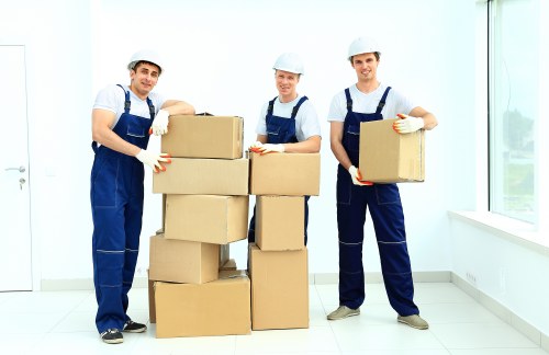 Packed furniture and boxes being loaded into a removal truck