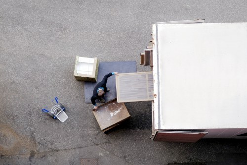 Packed office equipment and boxes ready for a business move in Lambeth
