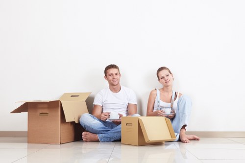 Professional removals staff handling boxes with care