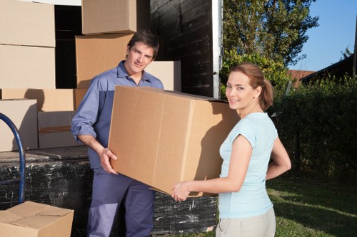 Packed moving boxes and furniture in a Lambeth home