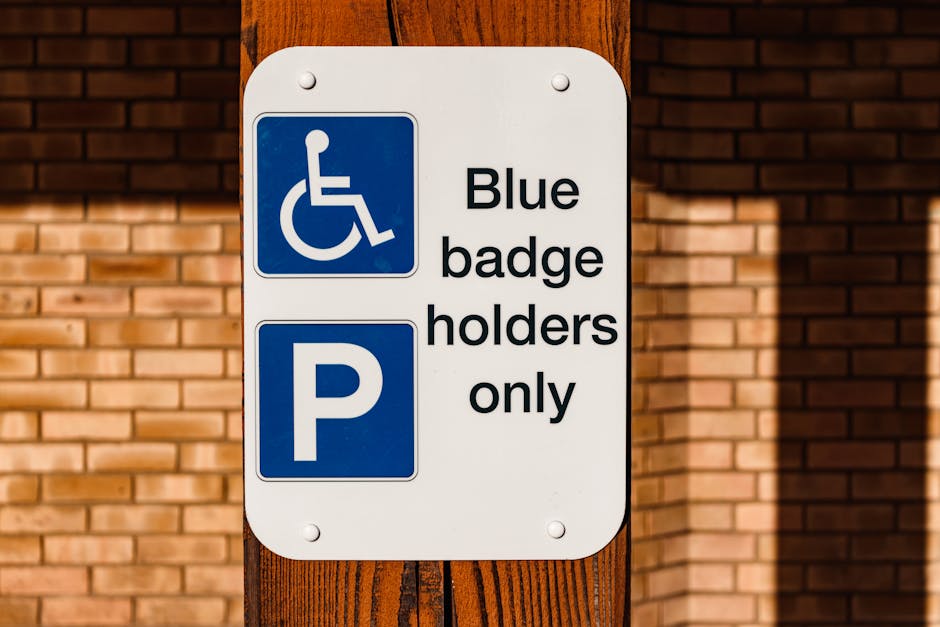 A close-up view of a white metal sign attached to a dark grey or black vented building exterior. The sign displays the text 'PRIVATE PROPERTY LOADING ZONE ONLY' in bold, black capital letters. The bac